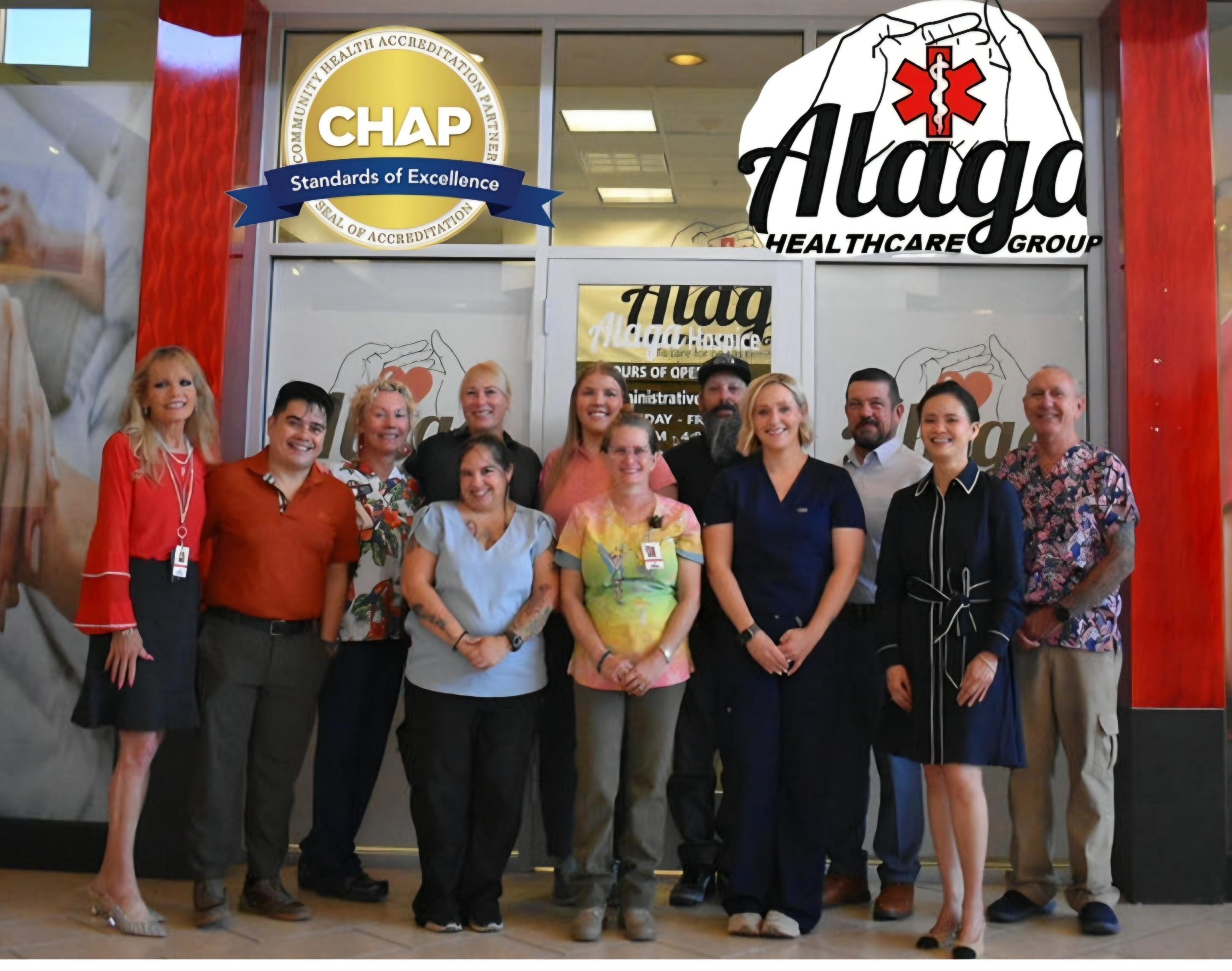 Alaga Healthcare staff posing in front of the office with the CHAP accreditation seal